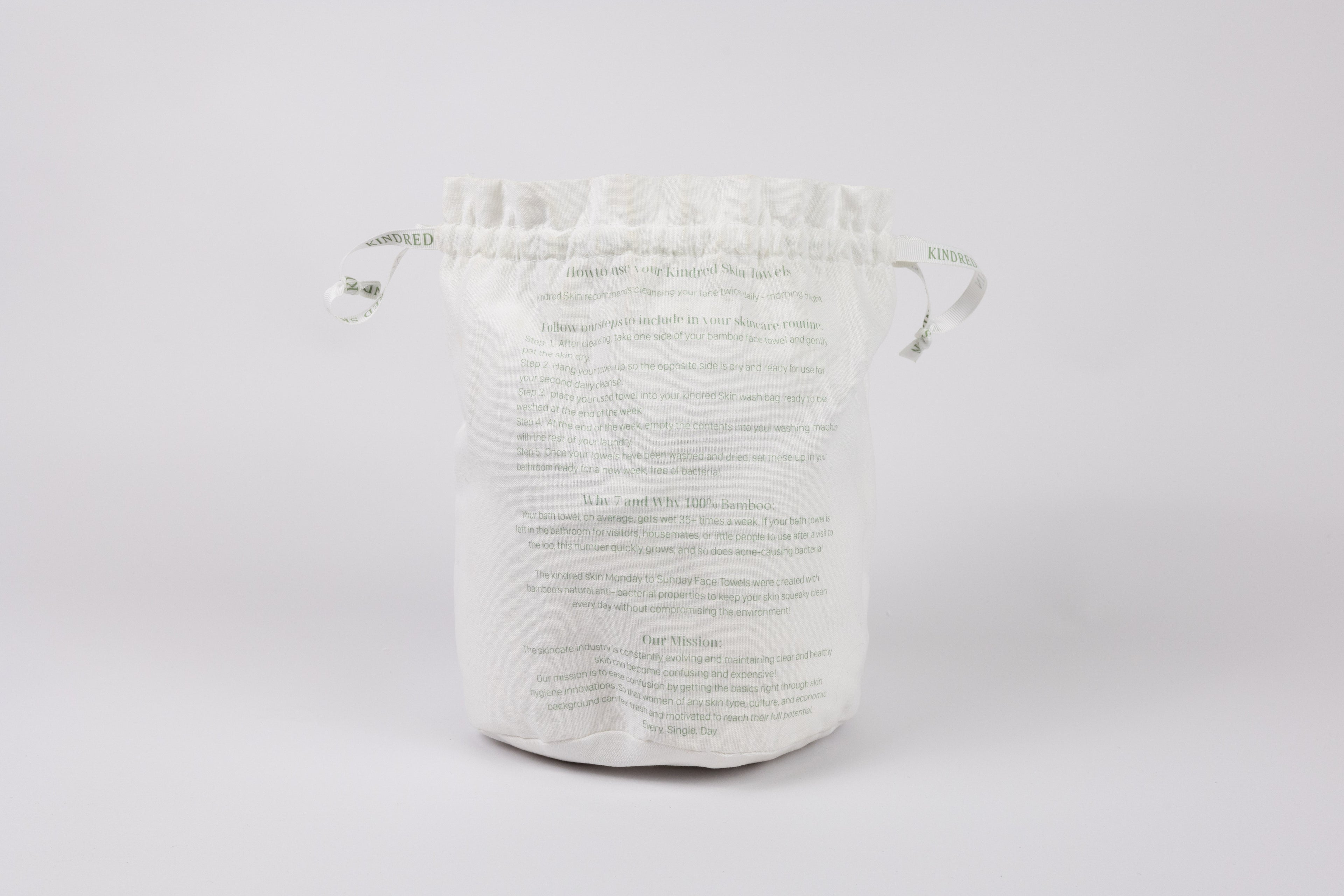 Antibacterial Bamboo Face Towels - Eco-friendly & Luxurious Skincare Essential in a bamboo back with ribbons sitting in bathroom for your basic needs 7 towels in laundry bag