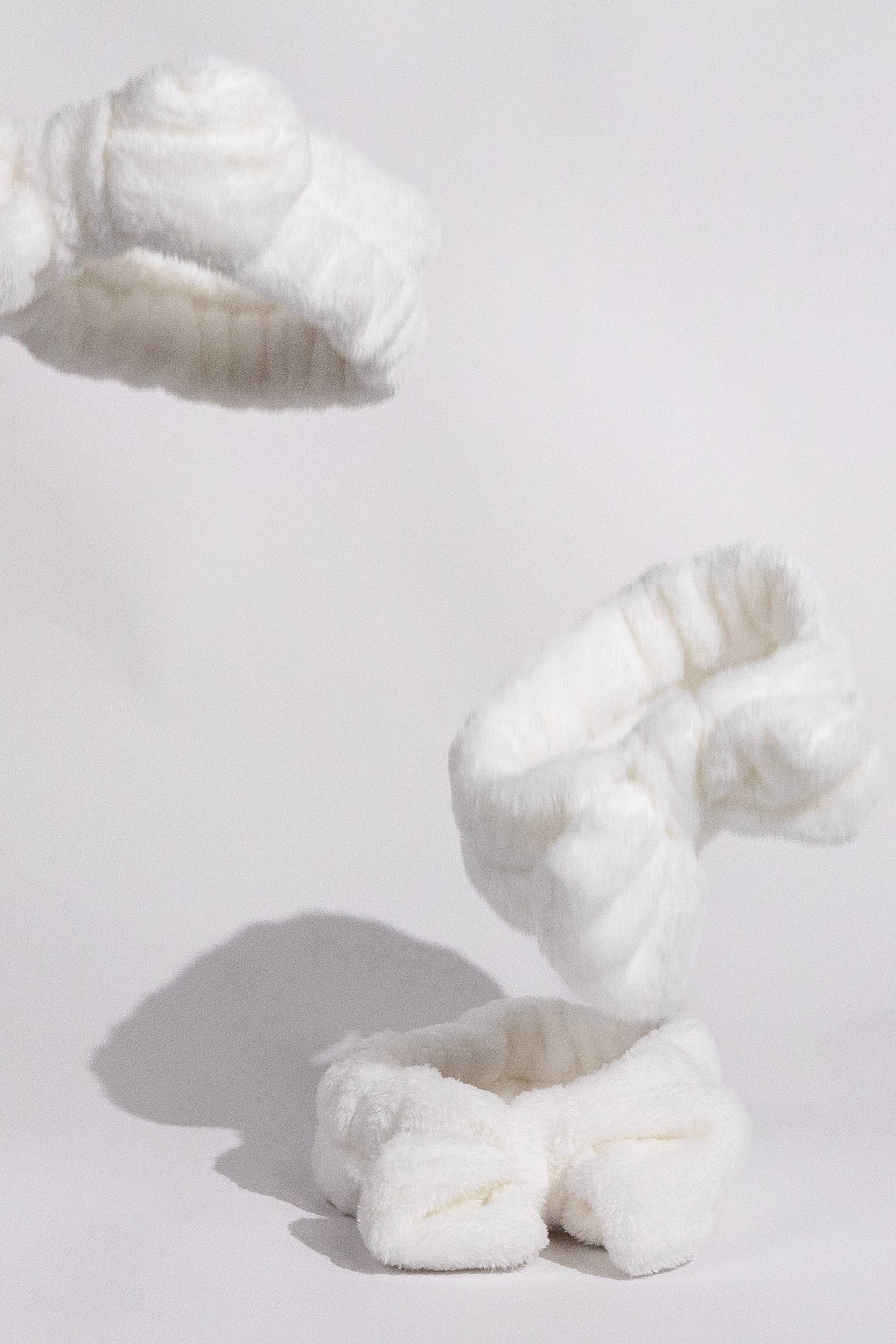 fluffy white ks kindred skincare headband to use for skincare routine to wash face with and keep hair back floating in the air product photo Comfortable Headbands for Your Skincare Routine - Australian Brand