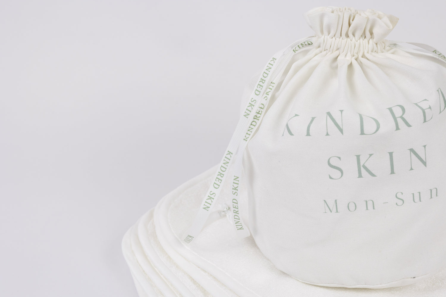 Antibacterial Bamboo Face Towels - Eco-friendly & Luxurious Skincare Essential in a bamboo back with ribbons sitting in bathroom for your basic needs 7 towels in laundry bag