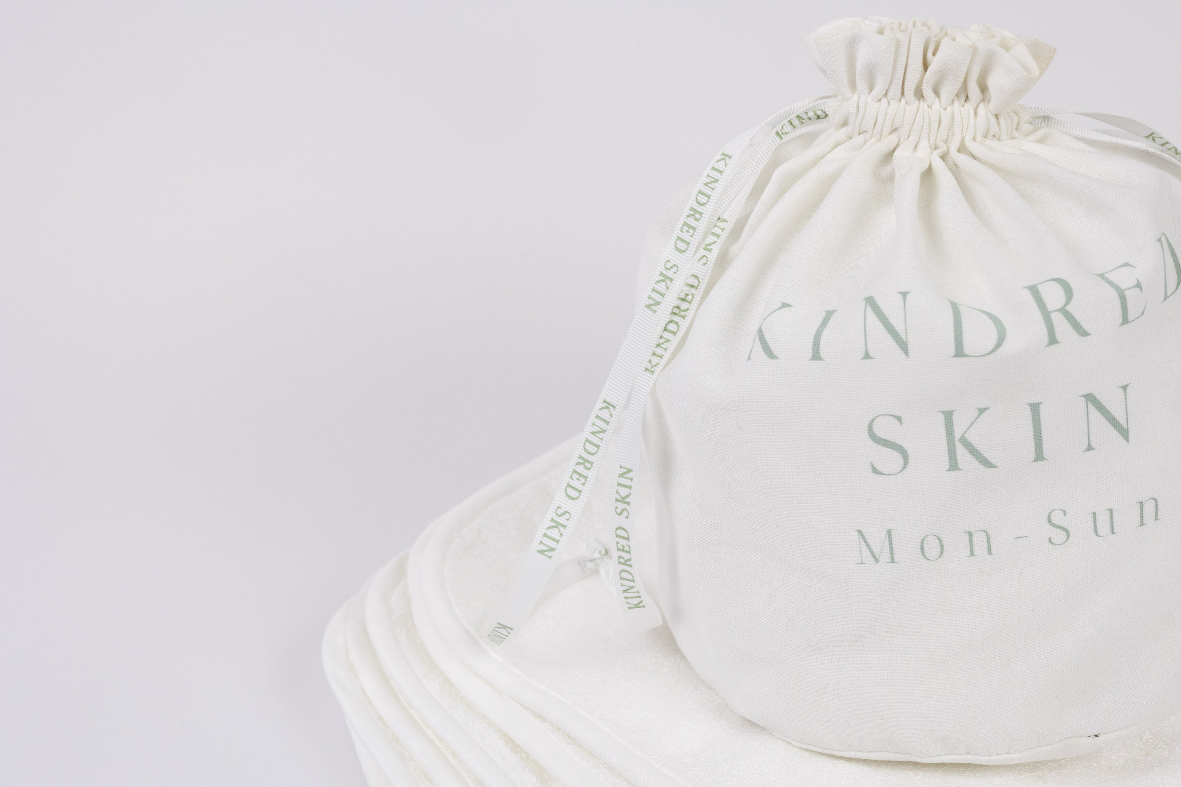 Antibacterial Bamboo Face Towels - Eco-friendly & Luxurious Skincare Essential in a bamboo back with ribbons sitting in bathroom for your basic needs 7 towels in laundry bag