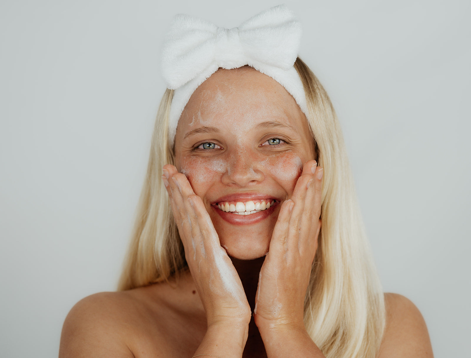 girl wearing fluffy ks headband for skincare routine - faq's frequently asked questions for kindred skincare woman all skin types australian brand
